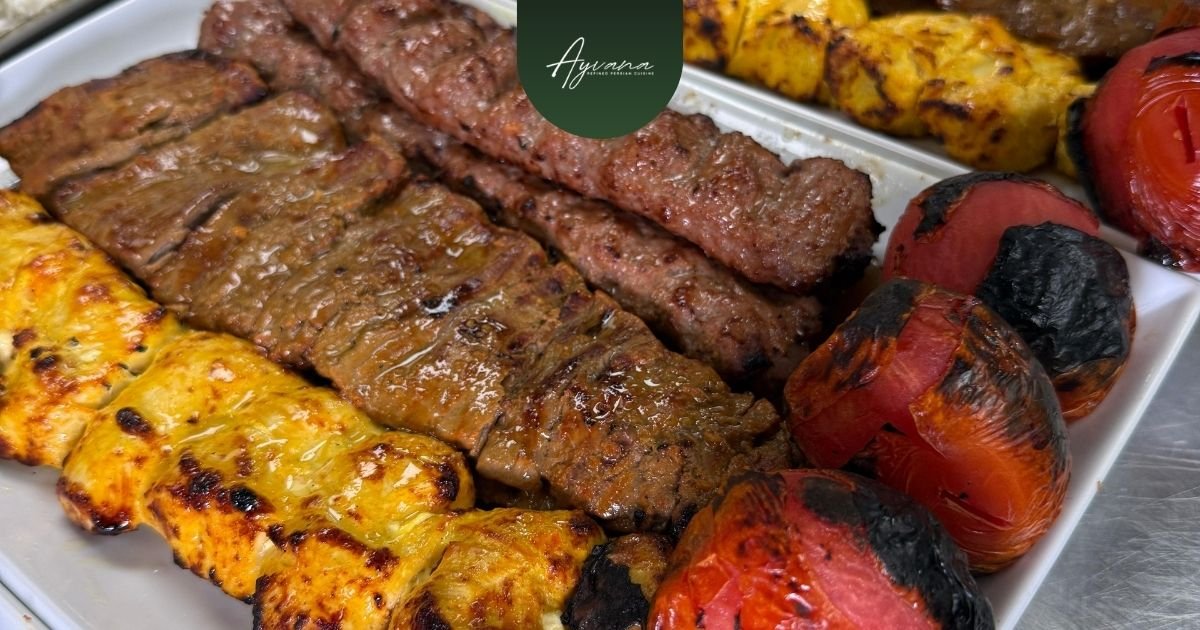 Assortment of Persian kebabs for group dining, including koobideh, joojeh kebab, barg kebab, and soltani kebab.