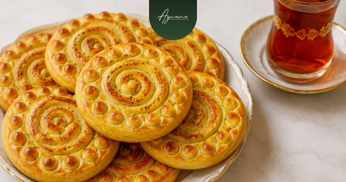 Traditional Persian koloocheh filled cookies served with Persian tea on a dessert plate