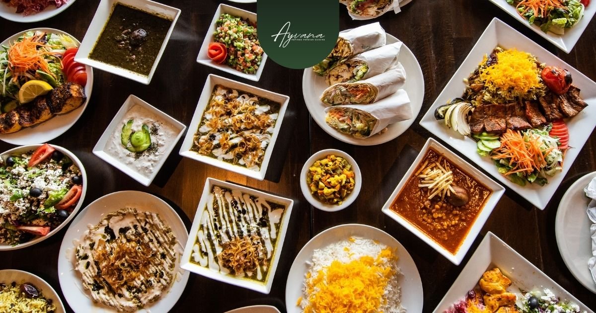 Popular Persian catering dishes including koobideh kebab, chicken kabob, zereshk polo, tahdig, and fesenjan served on a banquet table